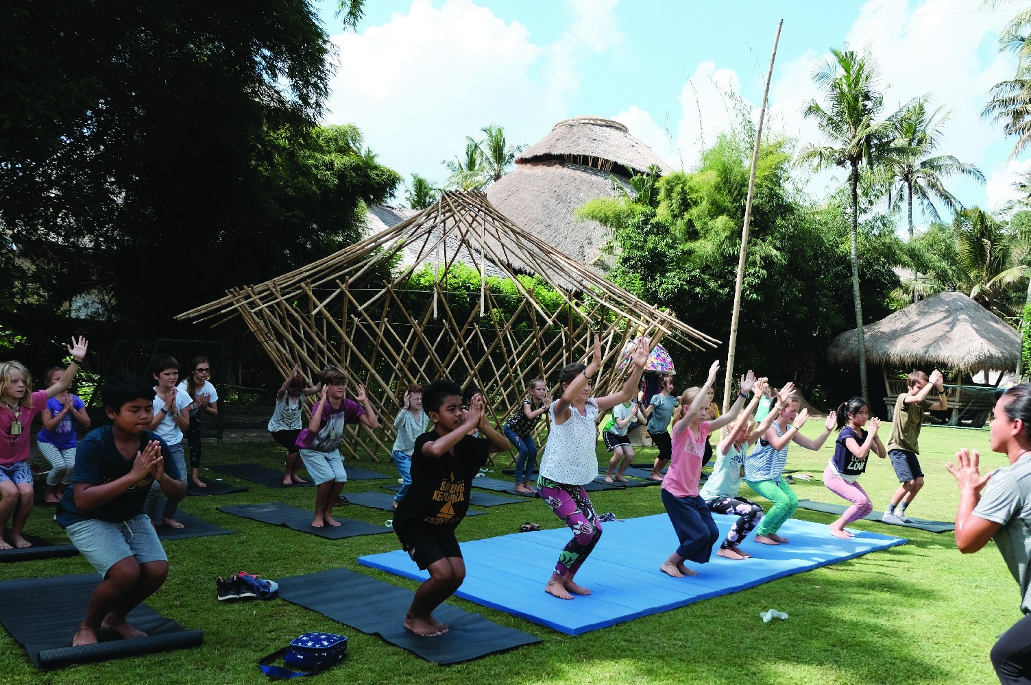 Teacher and students in a yoga class